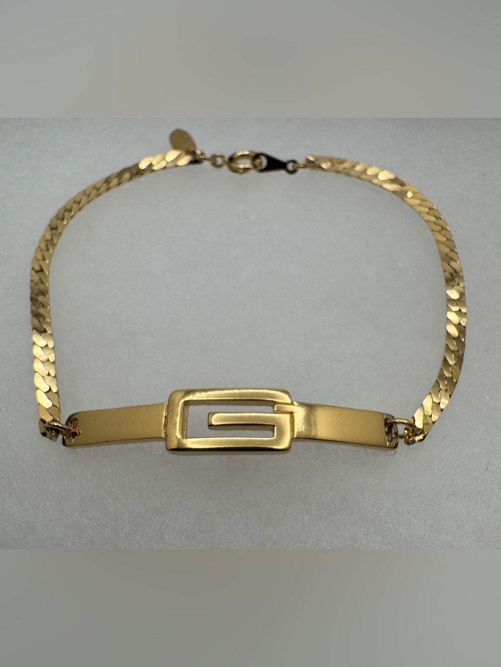 Givenchy Gold-Toned Signature G Plate Bracelet Size: 7”